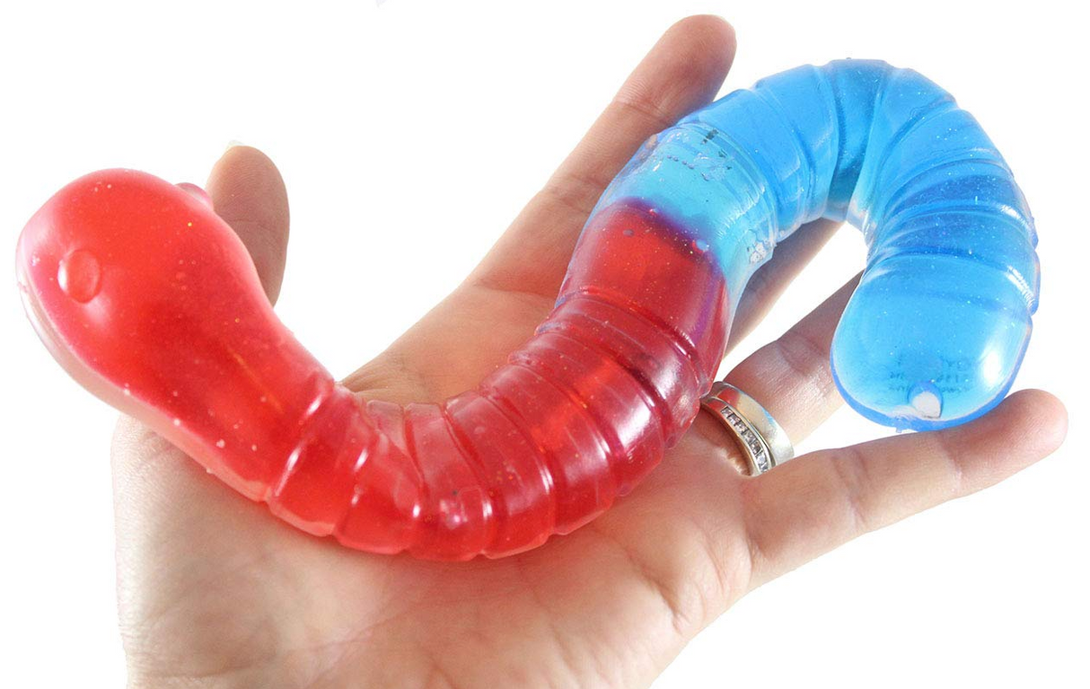 Jumbo Slimy Worm in red and blue colors held in hand, showing its stretchy, squishy, and gooey texture.