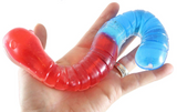 Jumbo Slimy Worm in red and blue colors held in hand, showing its stretchy, squishy, and gooey texture.