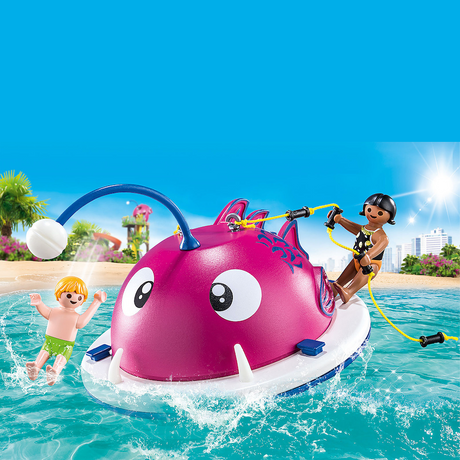 Family Fun | Swimming Island with two children playing, climbing the giant pink fish in water on a sunny day