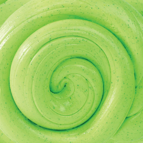 Close-up of vibrant green SCENTsory Crisp Apple Thinking Putty twisted to show its smooth, stretchy texture and speckled details.