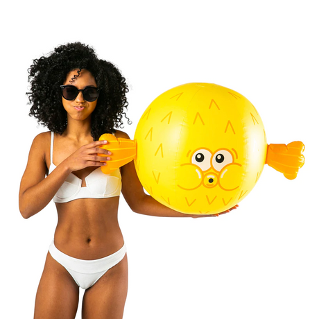 Woman in white bikini holding inflated bright yellow Beach Ball | Pufferfish with cute fins and face design