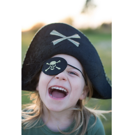 Child wearing a Pirate Captain Hat with a black eyepatch and smiling outdoors for imaginative play.