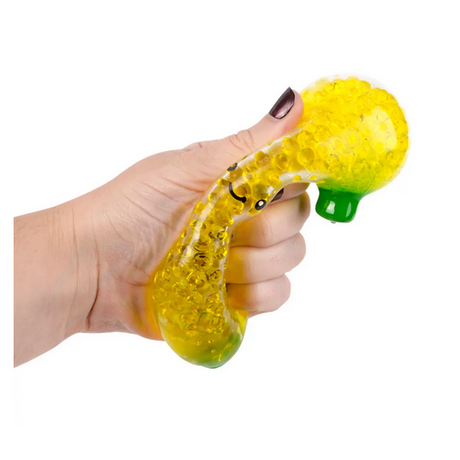 Hand squeezing a yellow Squeezy Bead Banana toy filled with liquid beads, perfect for stress relief and play.