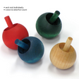Four assorted colored Wood Flipover Top toys made of hardwood, each sold individually and ready to spin.