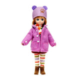 Lottie Autumn Doll wearing purple coat, hat with ears, striped leggings, scarf, and boots standing on white background.