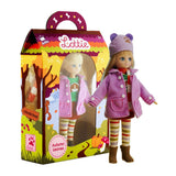 Lottie Autumn Doll wearing a pink coat and hat with striped leggings standing next to colorful autumn-themed packaging.