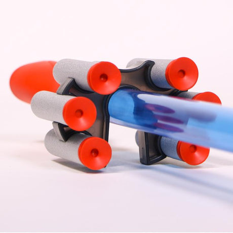Blow Darts set with transparent blue blow tube and six soft foam suction cup darts arranged in a holder.