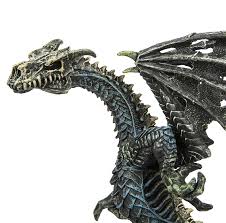 Ghost Dragon figure with black, grey, dark blue body, white skull face, and green horns, 5 ½ inches tall and detailed wings.