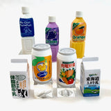 Japanese Eraser Drink puzzle erasers in beverage-themed designs including juice, milk, and soda bottles.