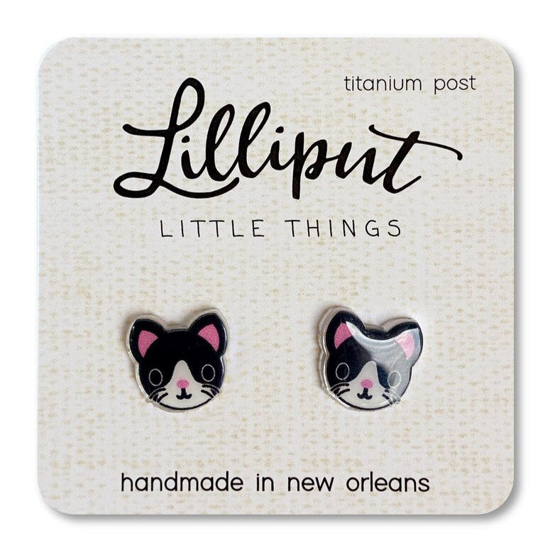 Tuxedo Kitty Earrings featuring detailed black and white cat faces with titanium posts, handmade in New Orleans.