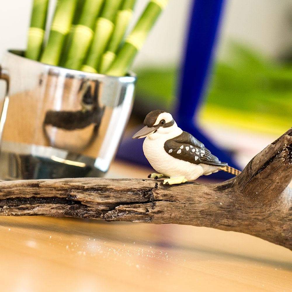 Kookaburra figurine perched on a branch, hand-painted with lifelike detail, part of Wings of the World Birds collection.