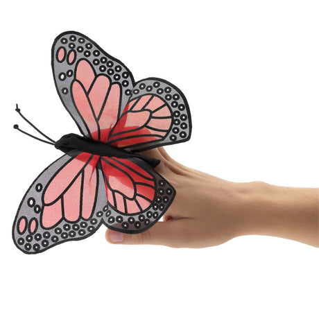 Monarch Butterfly Finger Puppet with sheer silk-screened wings and stretchy nylon body on a hand.