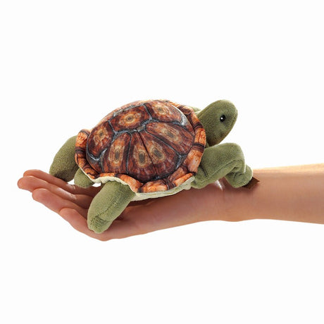 Tortoise Finger Puppet plush toy held on hand, showing detailed shell and soft green legs perfect for ages 3 and up.
