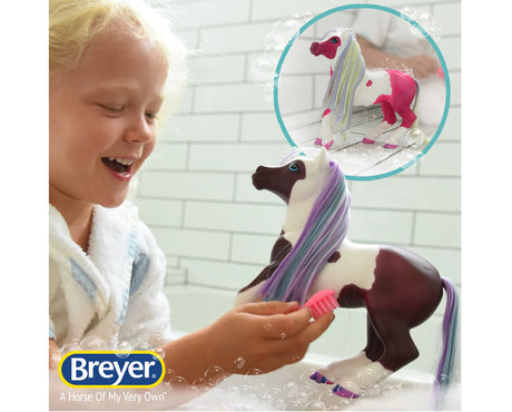 Marina Color Change Mer-Pony toy with color-changing markings and accessories shown with a smiling child playing.