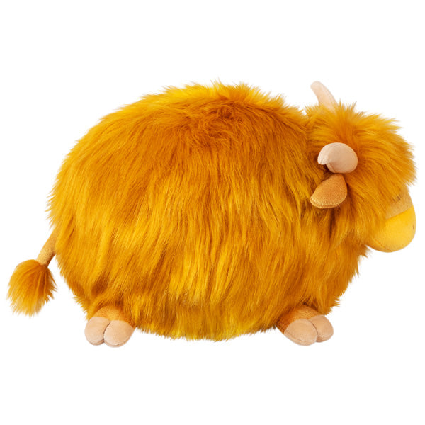 Plush and fluffy Highland Cow Mini with vibrant golden fur, soft horns, and a tail tuft, perfect for cozy decor or gifts.