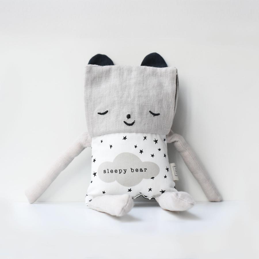 Organic Flippy Friend | Bear soft toy showing sleepy face with organic cotton fabric and star pattern on white background.