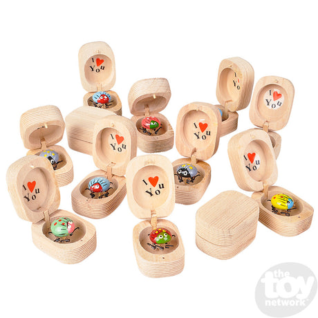 Bug in Box wooden keepsake boxes with assorted colorful bugs and I love you message inside each lid.