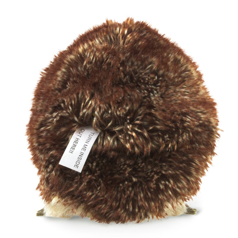 Hedgehog Puppet showing its fluffy back, designed to transform into a ball shape for playful safety mimicry.