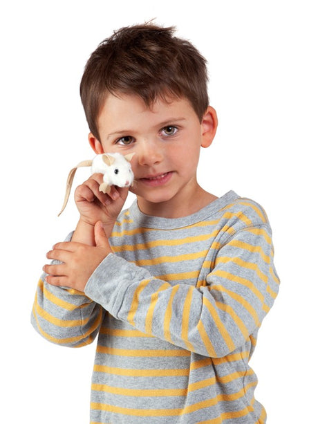 Young boy holding a Mini White Mouse Finger Puppet wearing a gray and yellow striped shirt.
