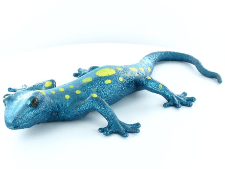 Blue and yellow spotted Lizard Squishimal toy shown stretched out on white background for kids to squish and stretch.