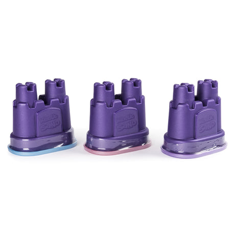 Three purple castle-shaped containers filled with pastel shimmering sand in the Kinetic Sand Shimmer Pack.