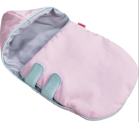 Doll Sleeping Bag in soft pink with reversible grey polka dot lining and hook and loop fasteners for cozy doll naps.