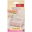 Crib with Mobile featuring a white baby bed with pink bedding and a rotating flower mobile above for soothing triplets.