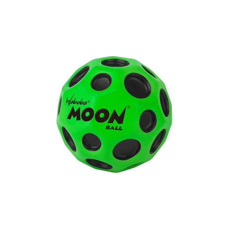 Green Waboba Moon Ball with black craters designed for high bounce on hard surfaces, perfect for outdoor play.