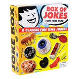Joke Box with 8 classic gags including goofy teeth, hand buzzer, floating eyeball, fake vomit, and whoopee cushion.