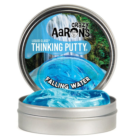 Liquid Glass Falling Water Thinking Putty in a silver tin, crystal-clear blue with shimmering iridescent edges.