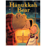 Hanukkah Bear book cover showing a bear and Bubba Brayna by a lit menorah on a winter night.