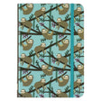 Sloths Journal with playful sloth pattern on blue cover and blue elastic closure for secure writing.