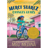 Merci Suarez rides a bike in a vibrant Florida neighborhood on the cover of Merci Suarez Changes Gears.