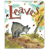Leaves board book cover with a young bear exploring colorful autumn leaves on a tree-lined path.