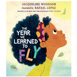 Cover of The Year We Learned to Fly showing a girl with curly hair looking up surrounded by falling leaves.