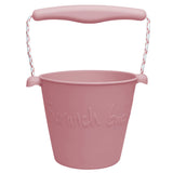 Scrunch Bucket Dusty Rose with rope handle, flexible 100% LFGB silicone, 1.5L capacity, perfect for kids aged 12 months plus.