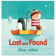 Lost and Found cover showing a boy and a penguin on a boat in icy waters under a starry sky.